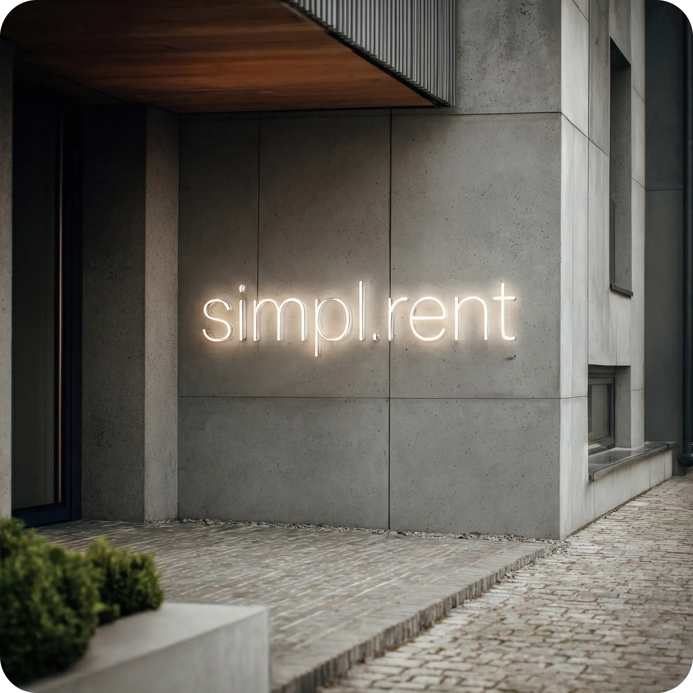 Wejście do biura simpl.rent z podświetlanym logo na ścianie